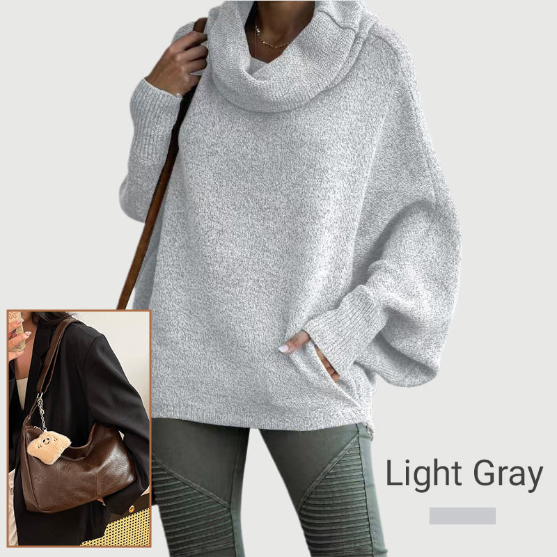 Ženski pulover z netopirskim ovratnikom in žepi