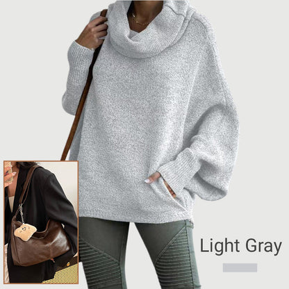 Ženski pulover z netopirskim ovratnikom in žepi